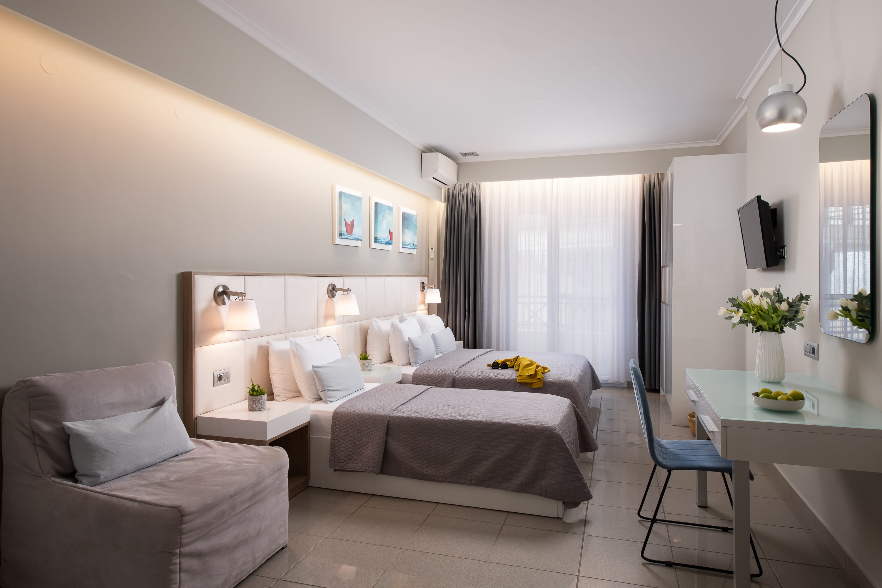 a bedroom with a bed and a couch