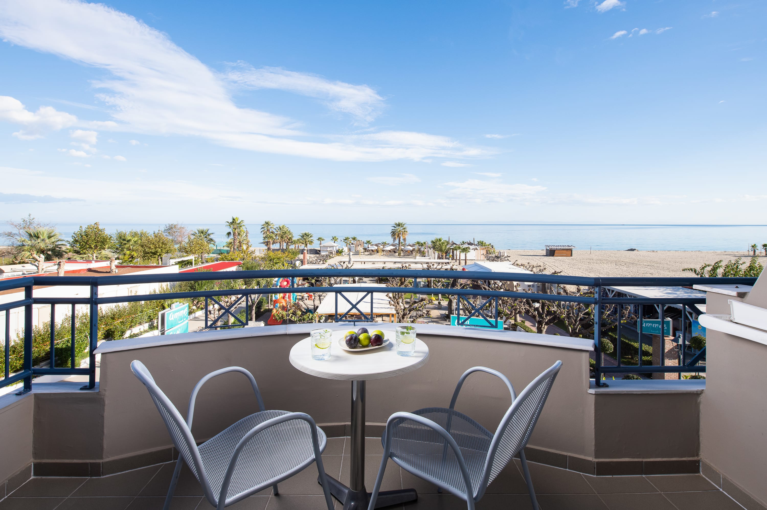a table and chairs on a balcony