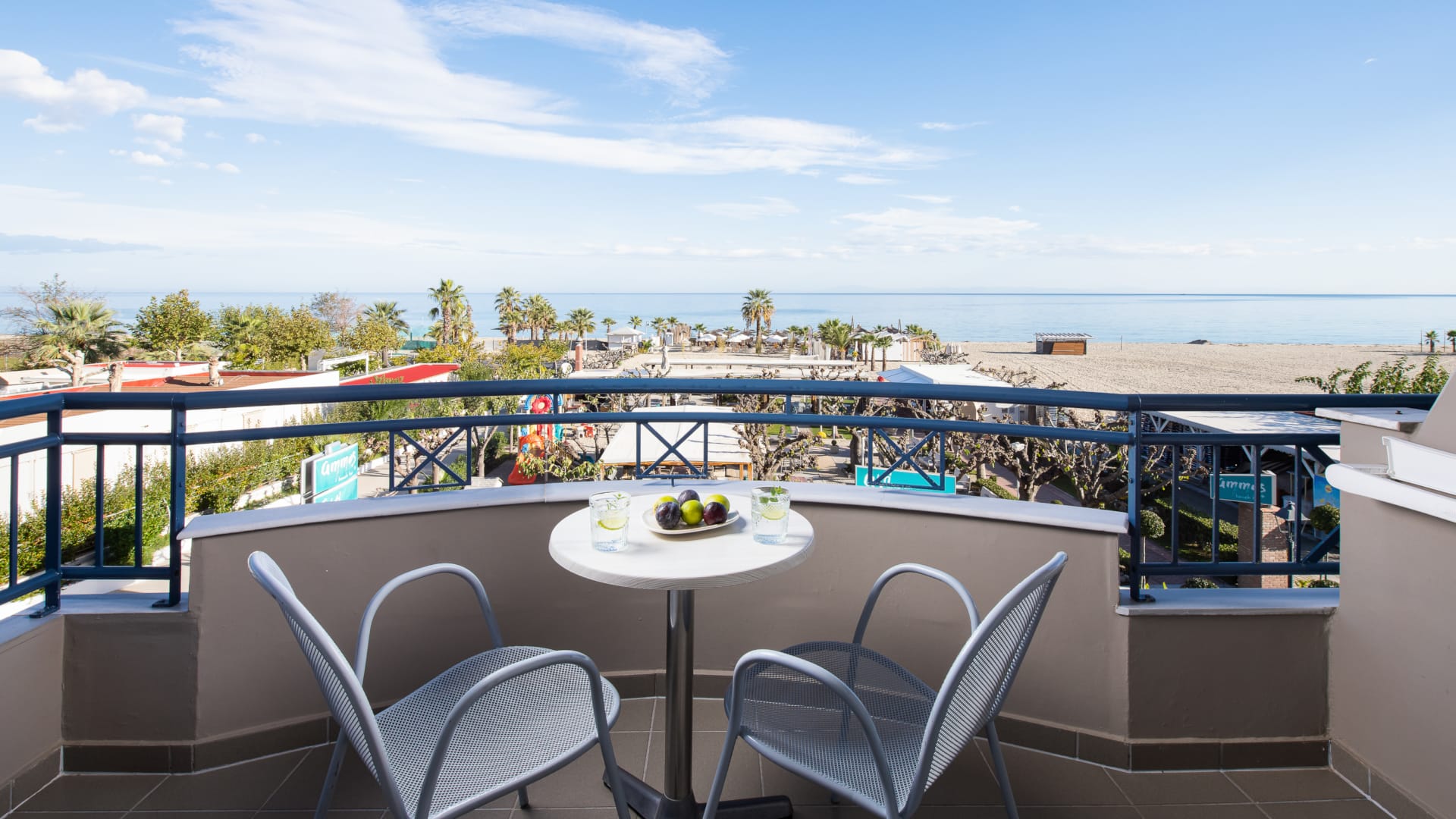 a table and chairs on a balcony