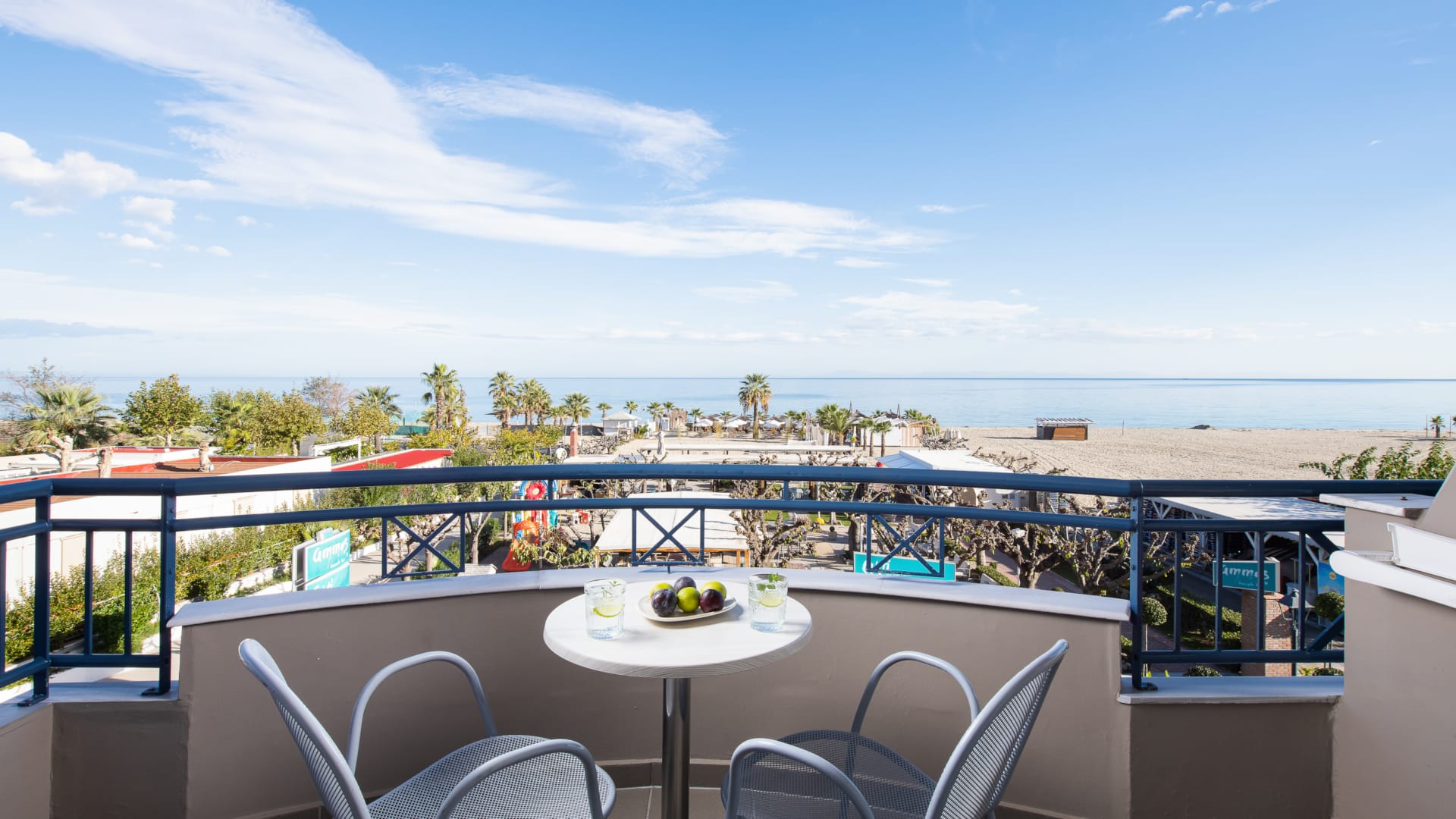 a table and chairs on a balcony
