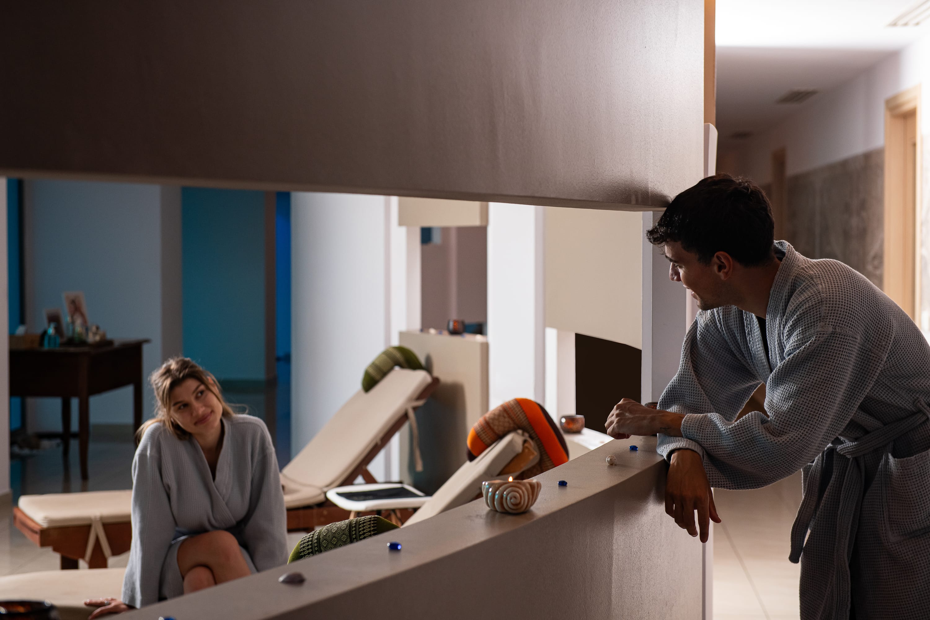 a man and a woman working on a model airplane