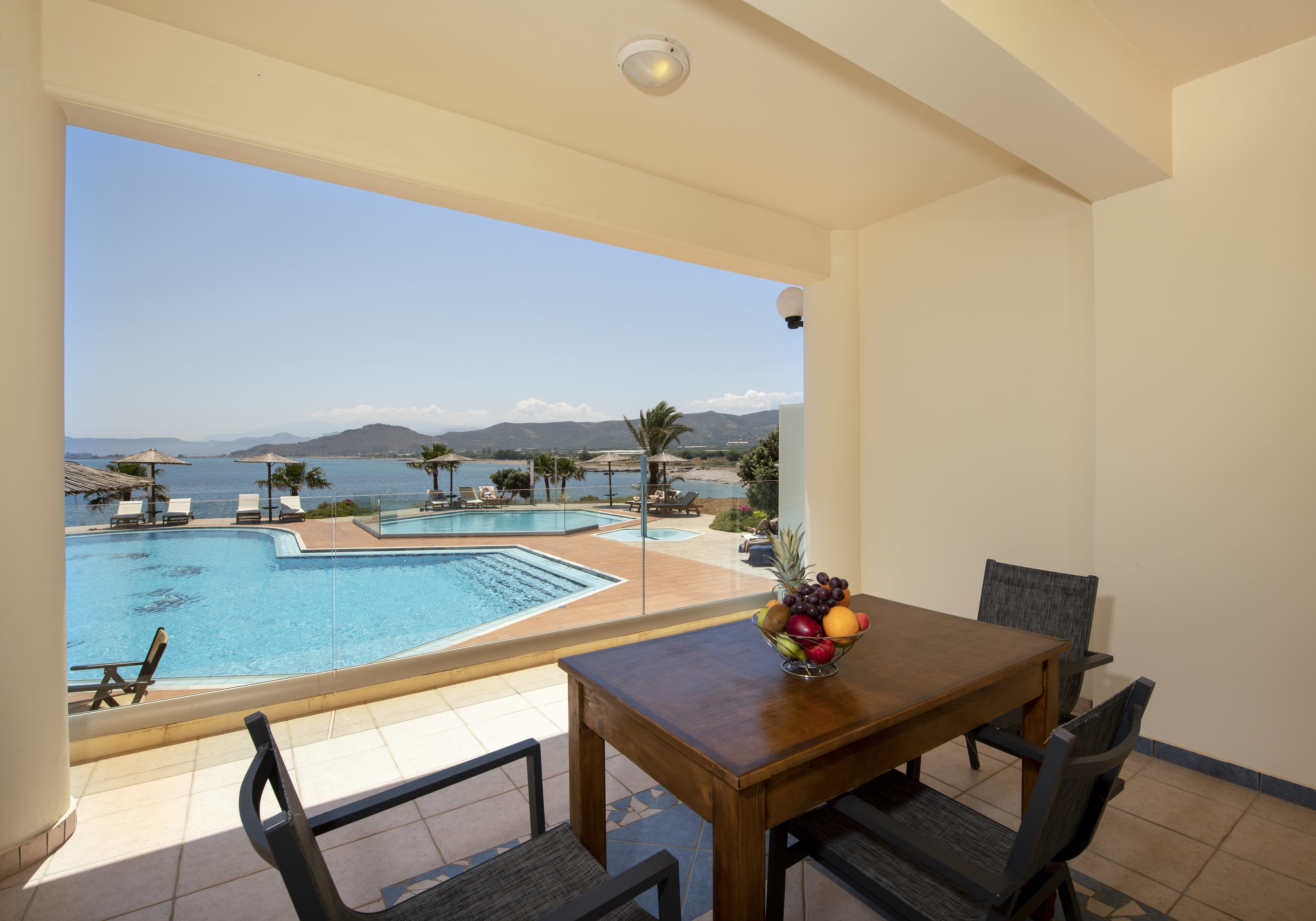 a table and chairs by a pool
