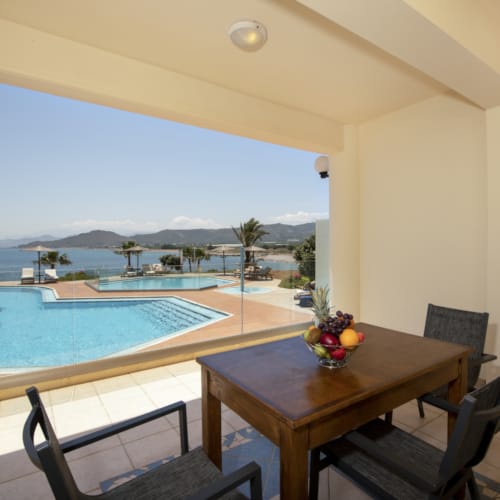 a table and chairs by a pool