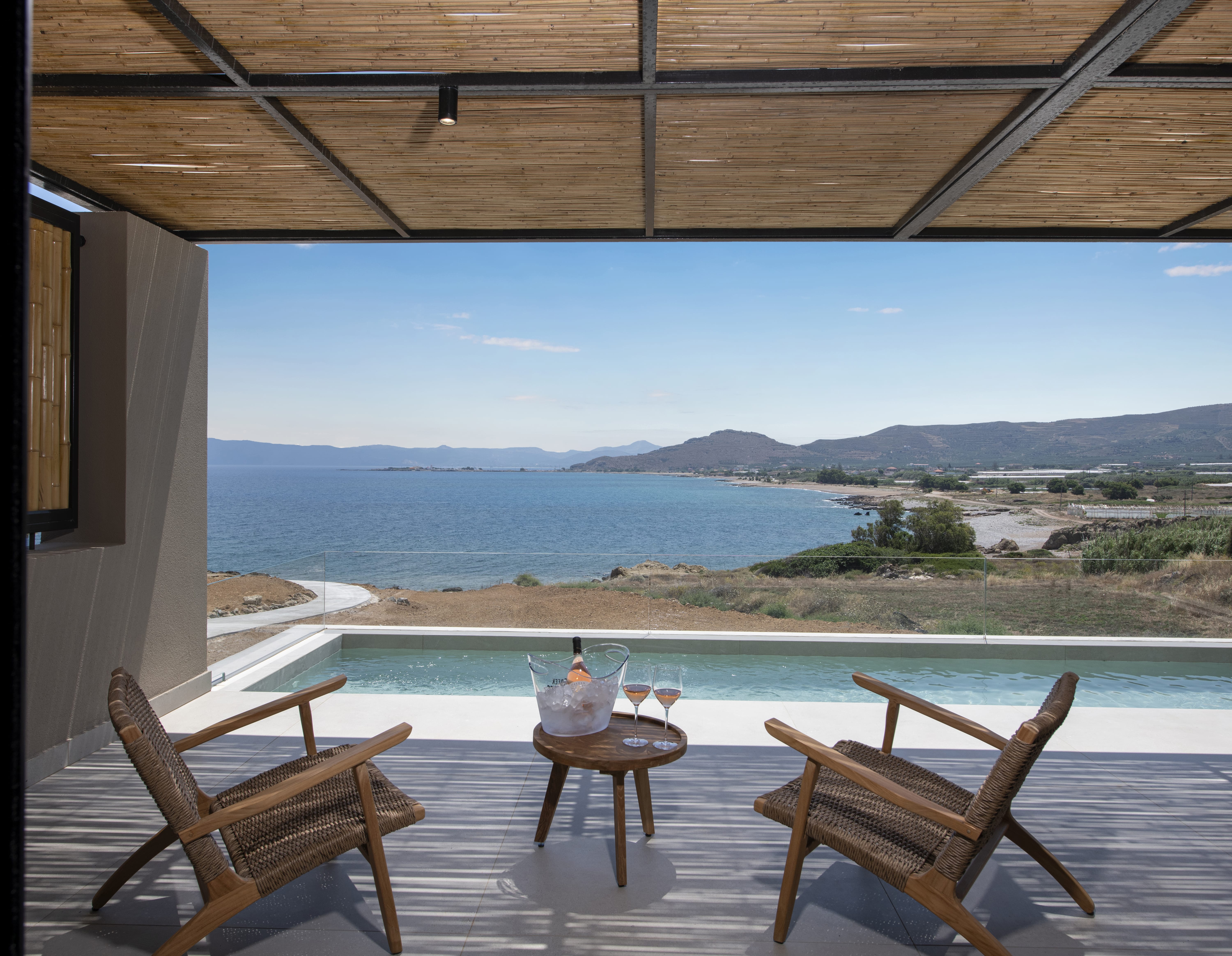 a pool with chairs and a table