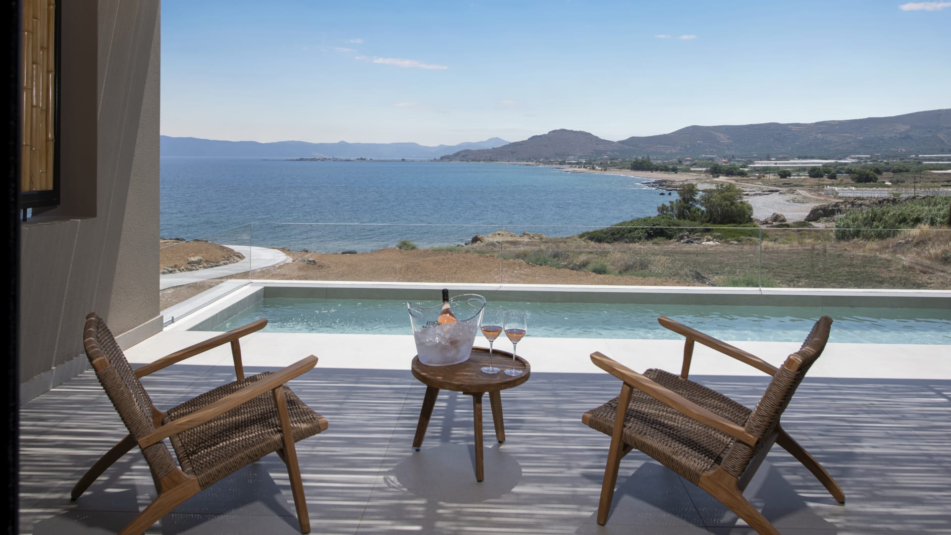 a pool with chairs and a table