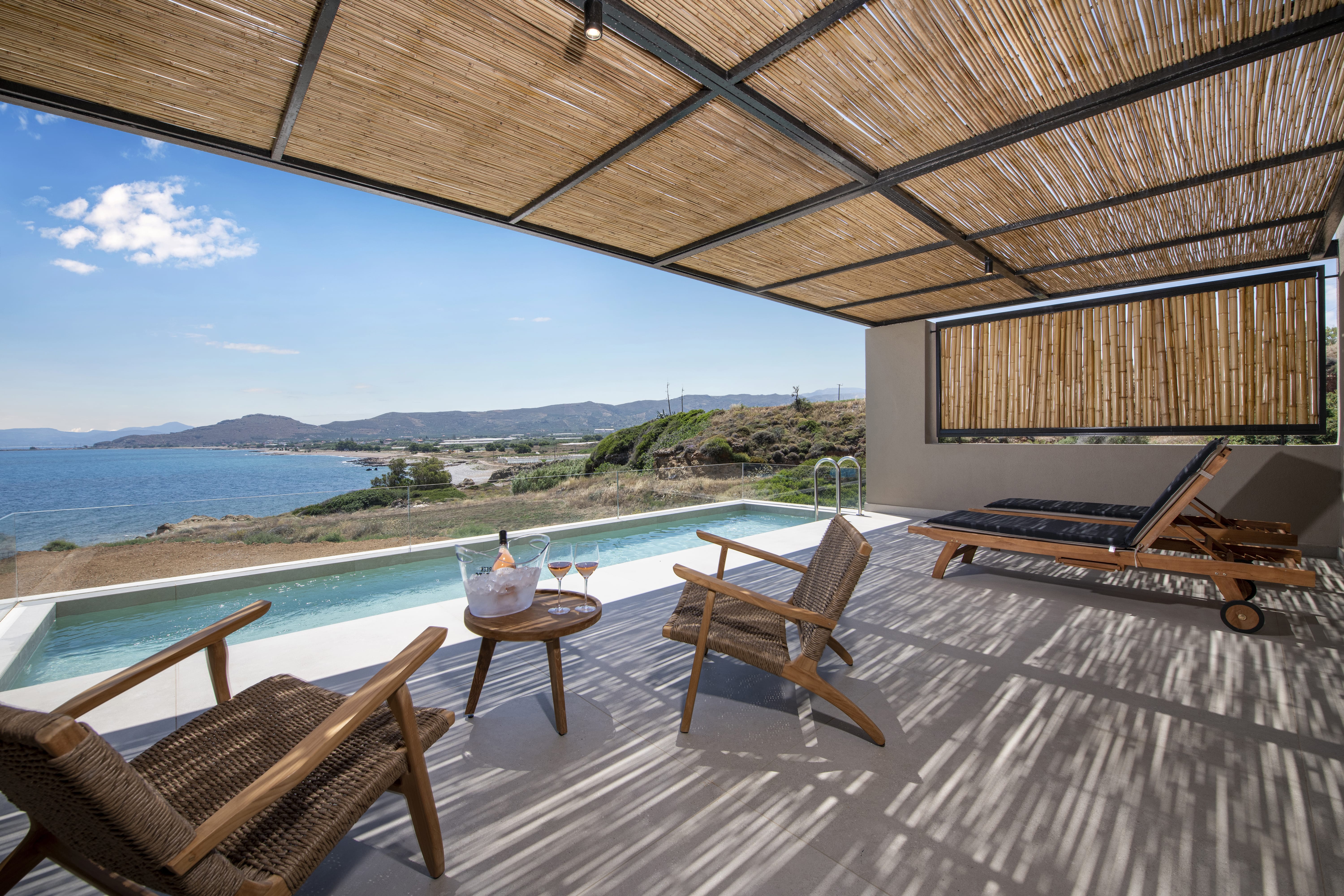 a deck with chairs and a table