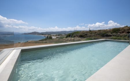 a body of water with land in the back