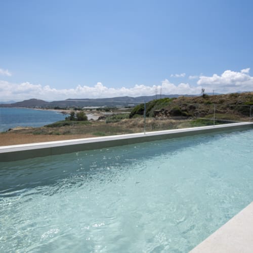 a body of water with land in the back