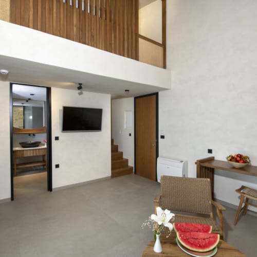 a room with a table and chairs