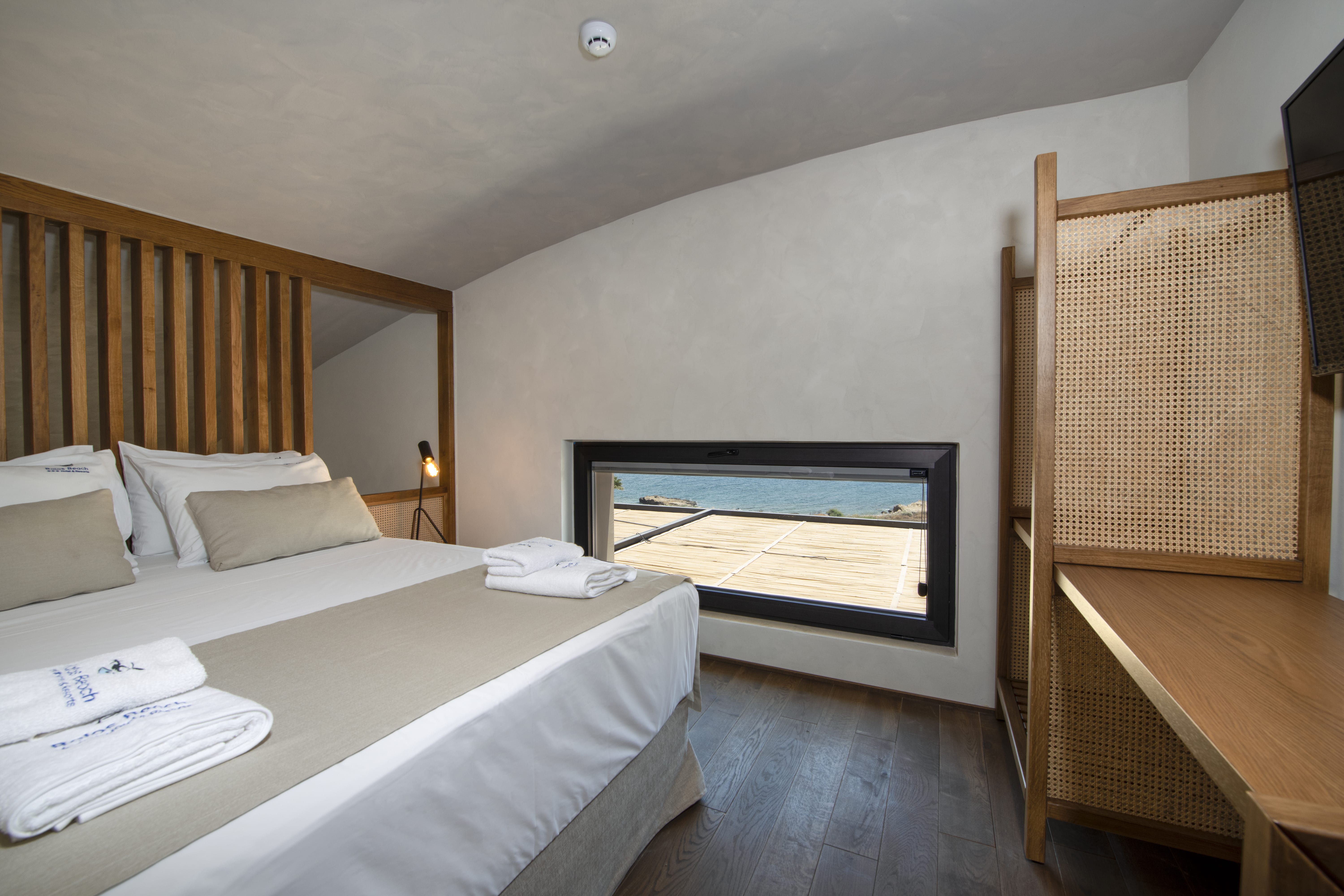 a hotel room with a bed and a tv