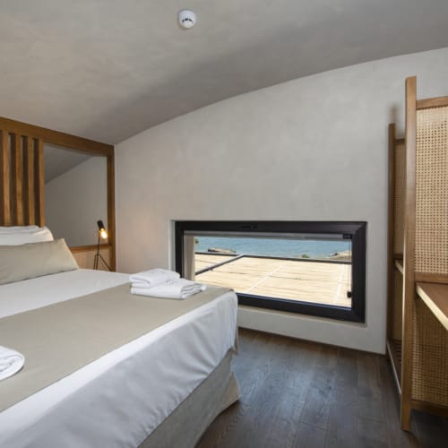 a hotel room with a bed and a tv