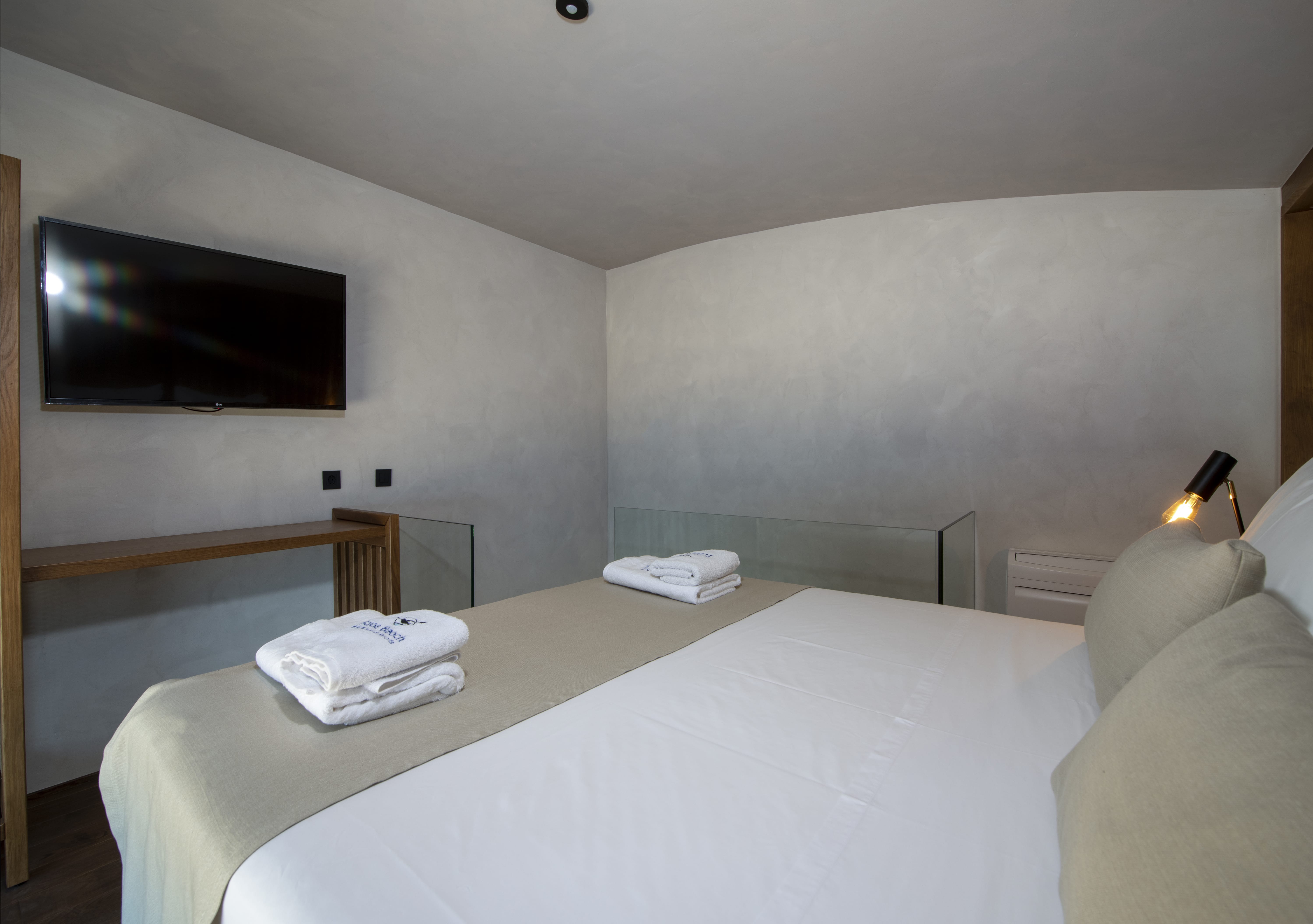 a bed with a white sheet