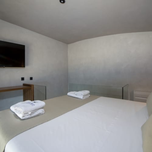 a bed with a white sheet