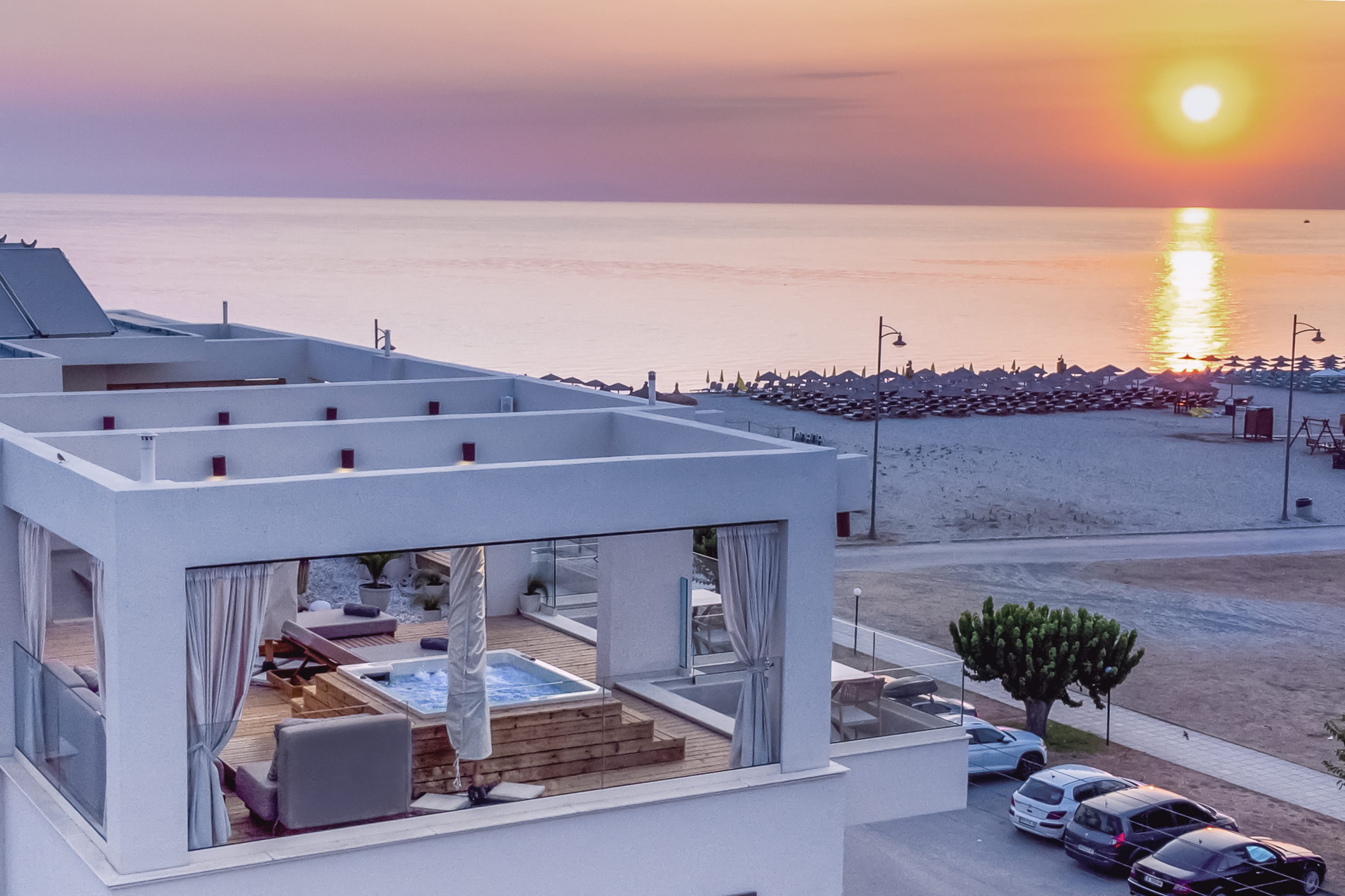 a building with a sunset in the background