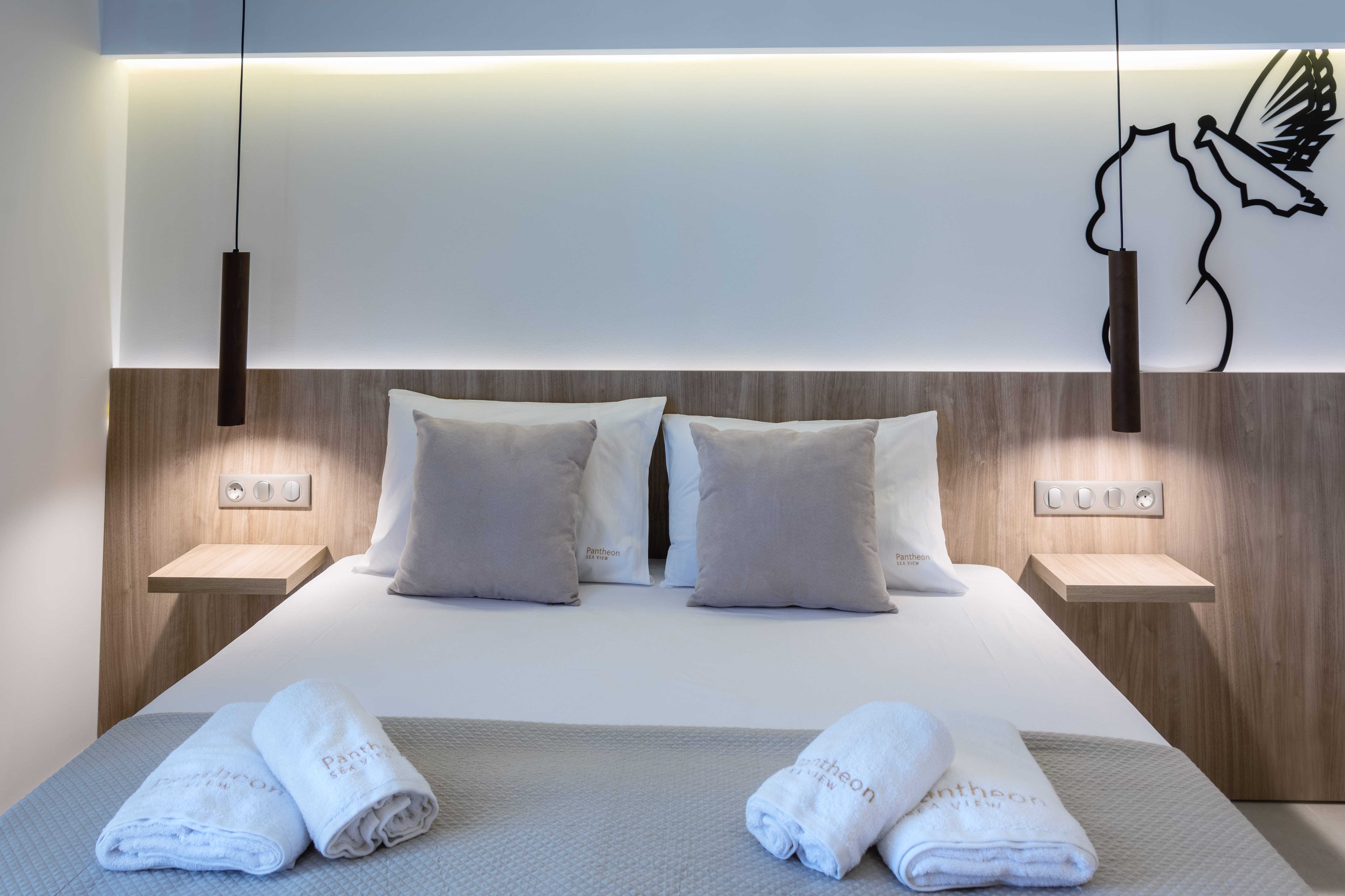 a bed with white sheets