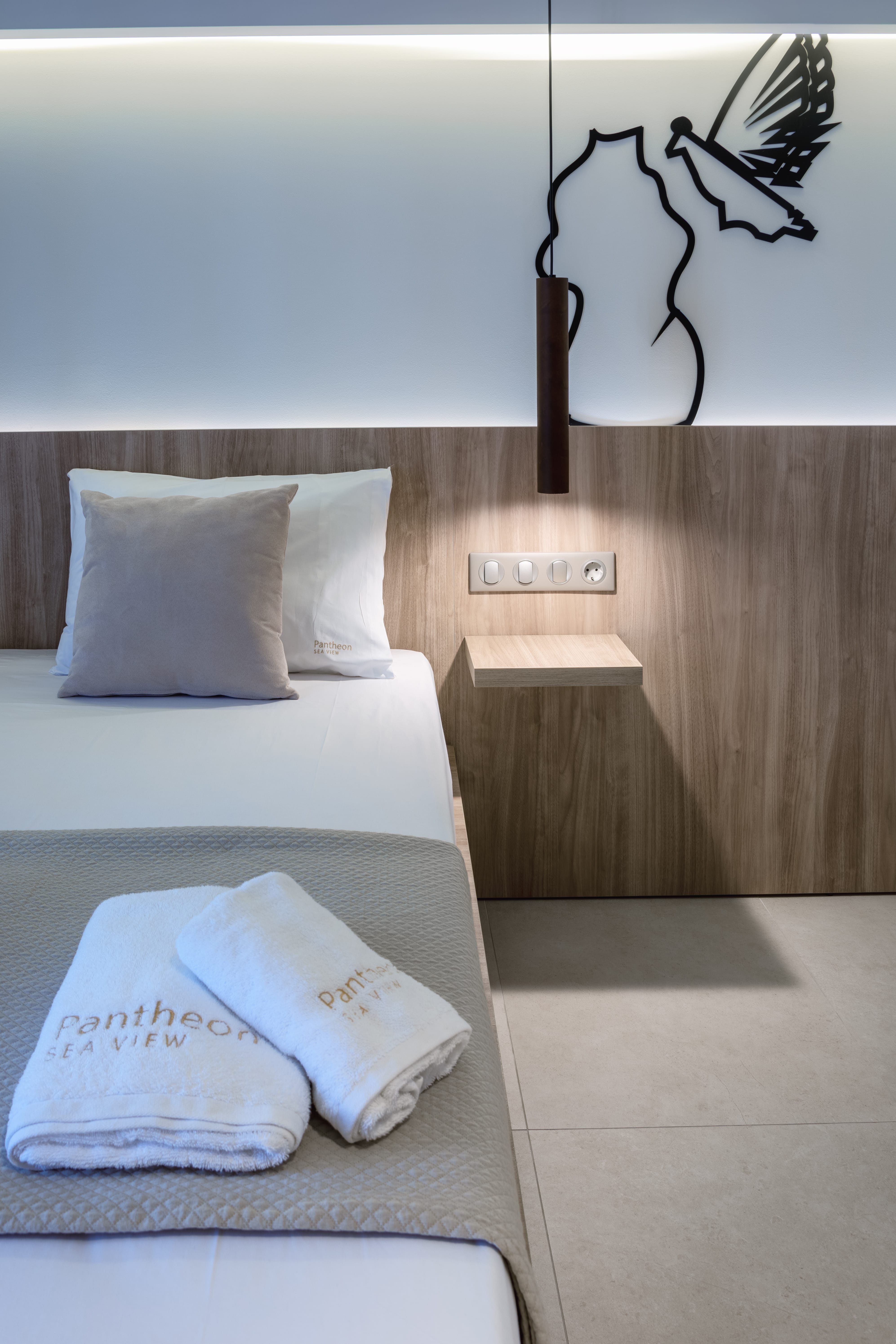 a bed with white pillows