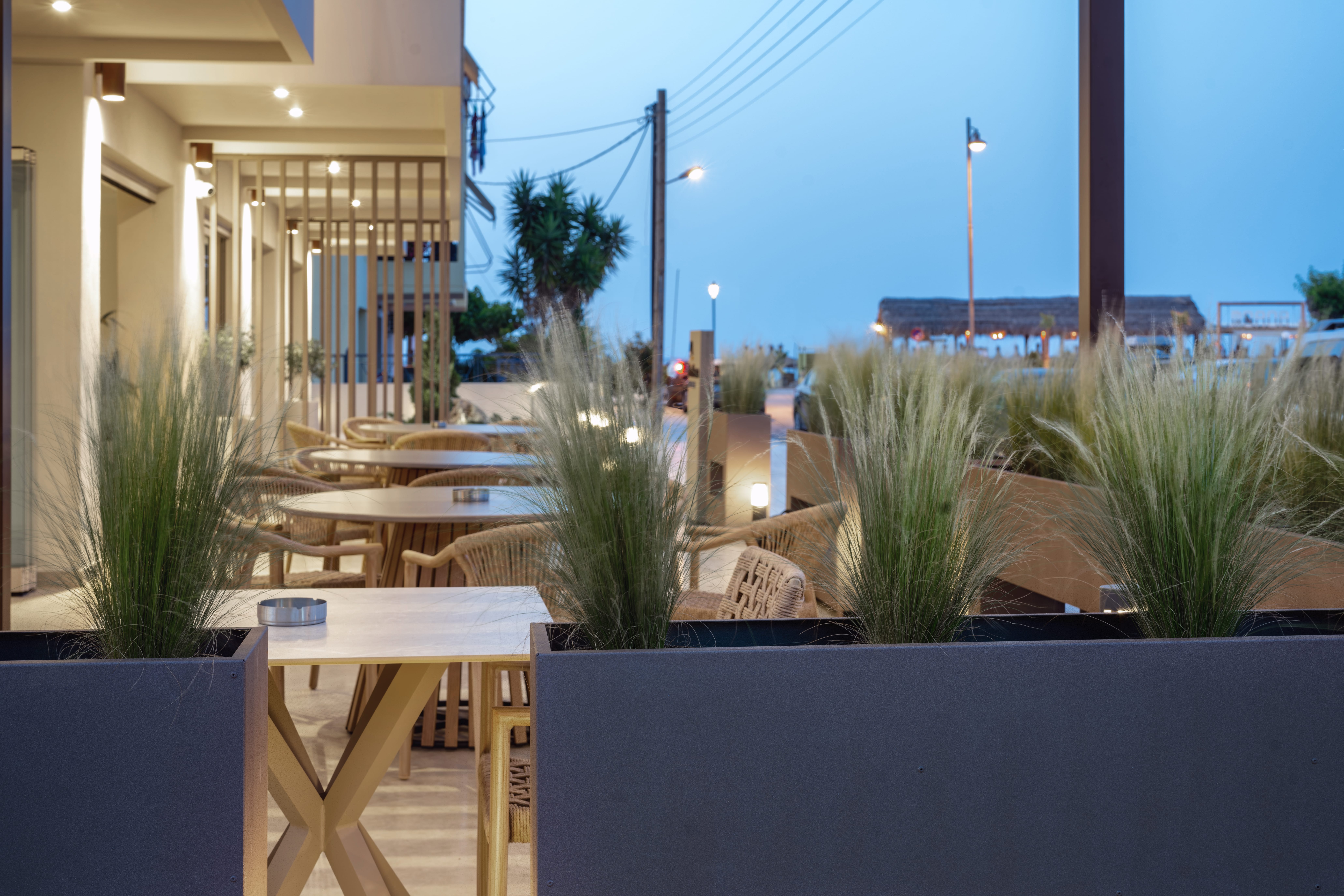 a patio with tables and chairs