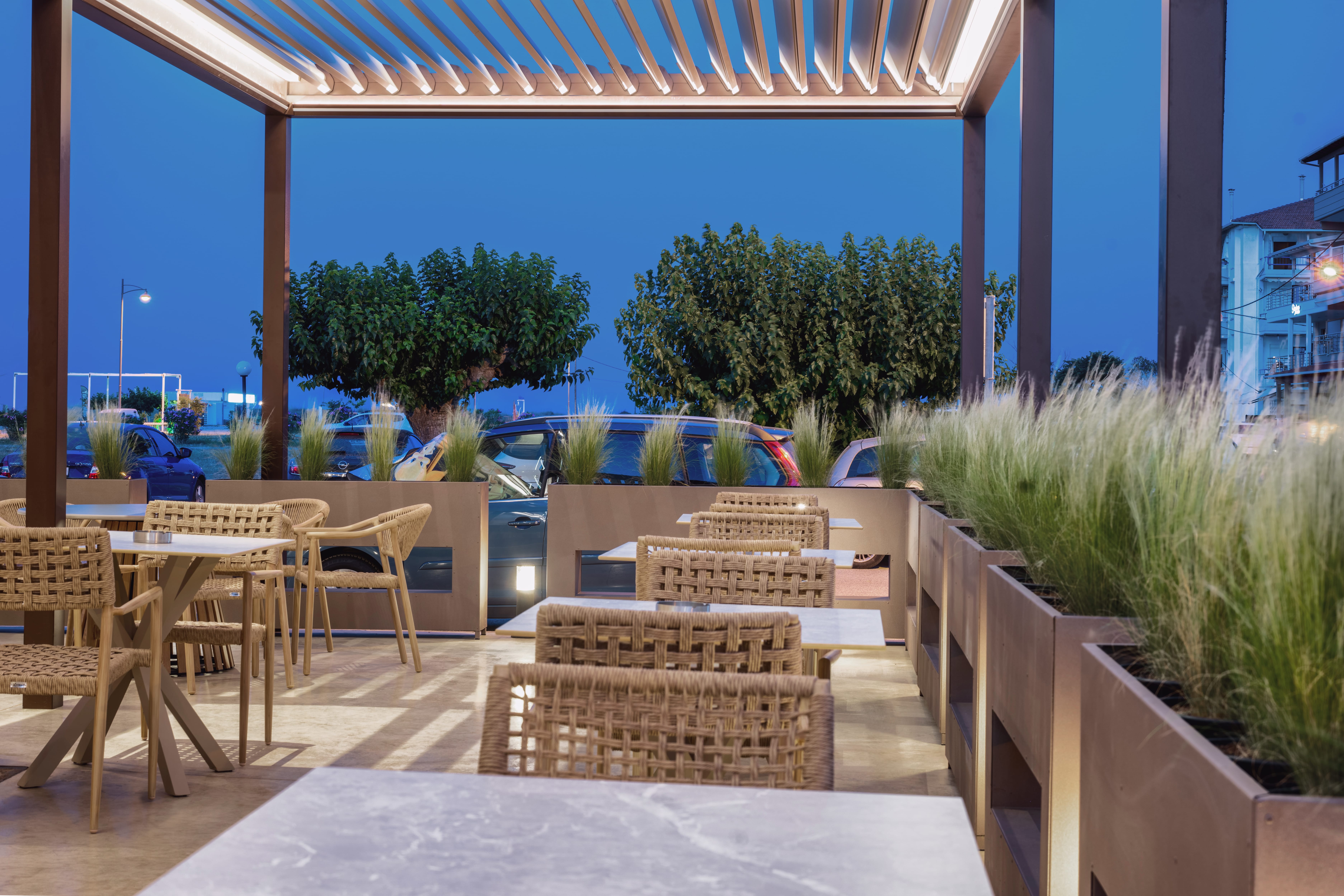 a patio with chairs and tables