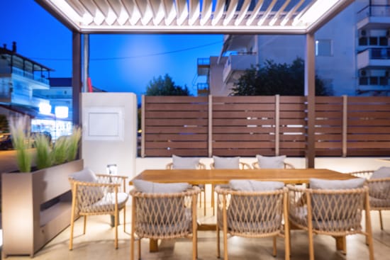 a table with chairs and a refrigerator