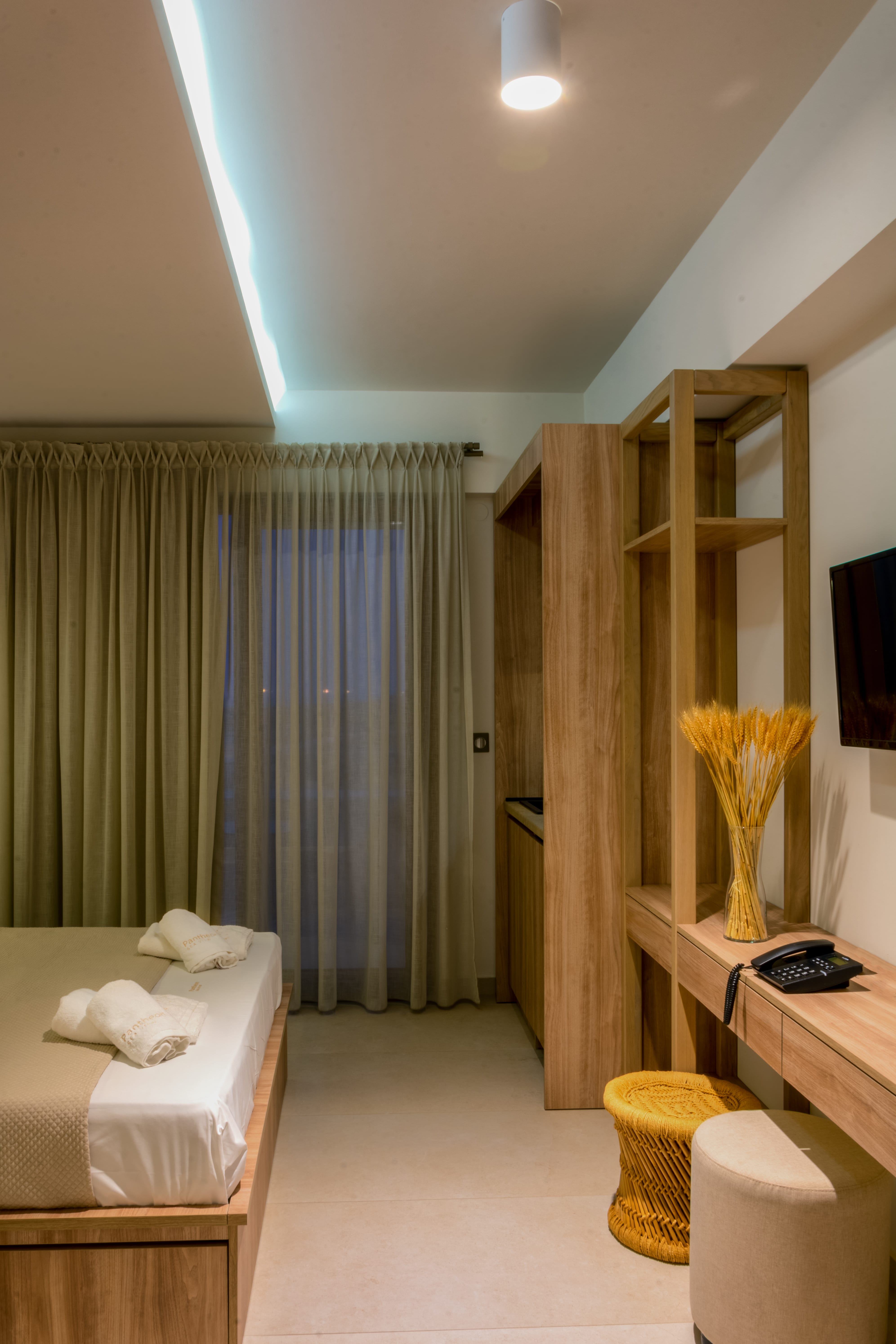 a room with a bed and a desk