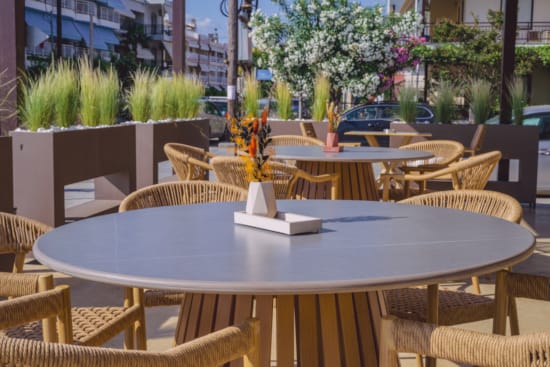 a group of tables and chairs outside