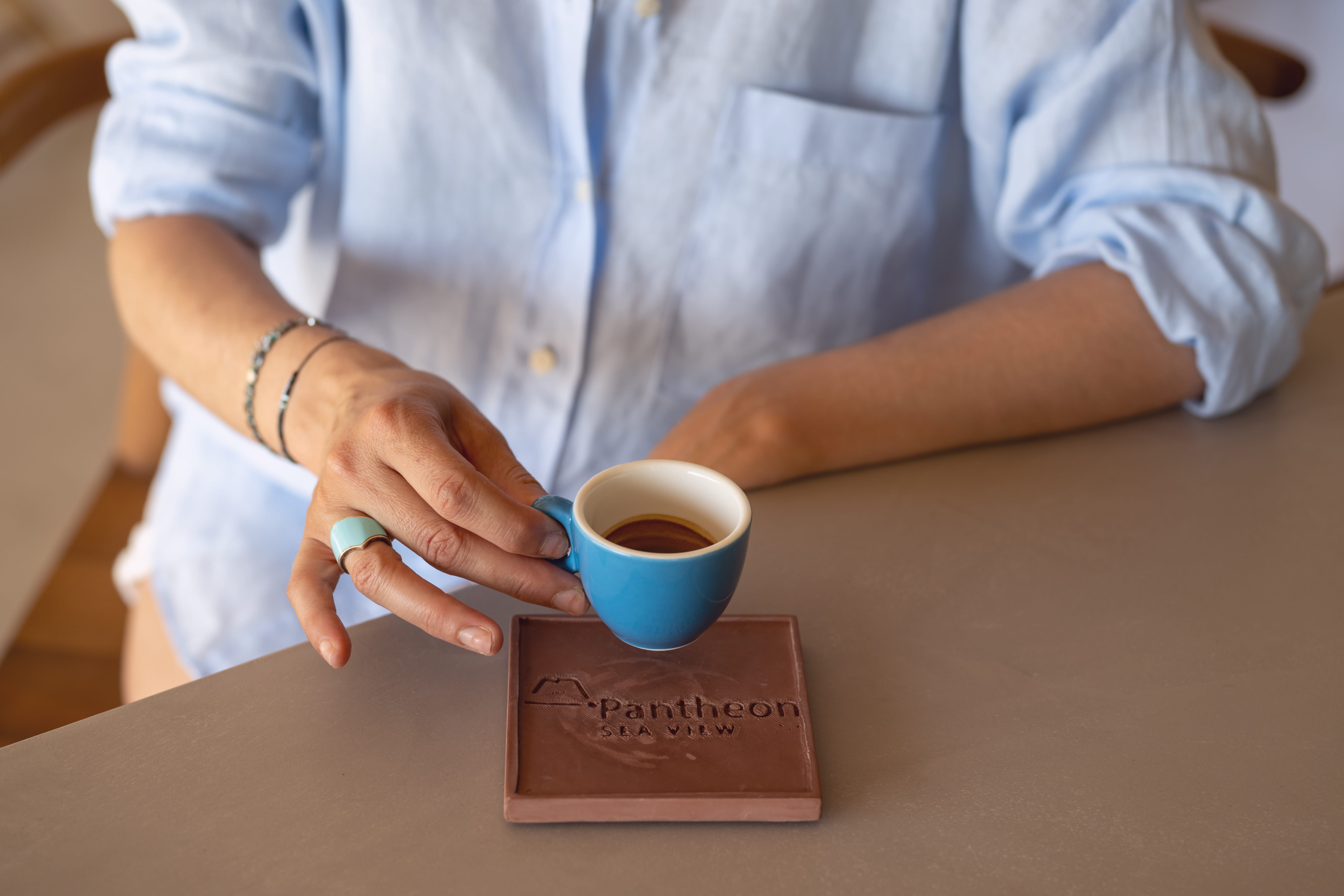 a person holding a cup