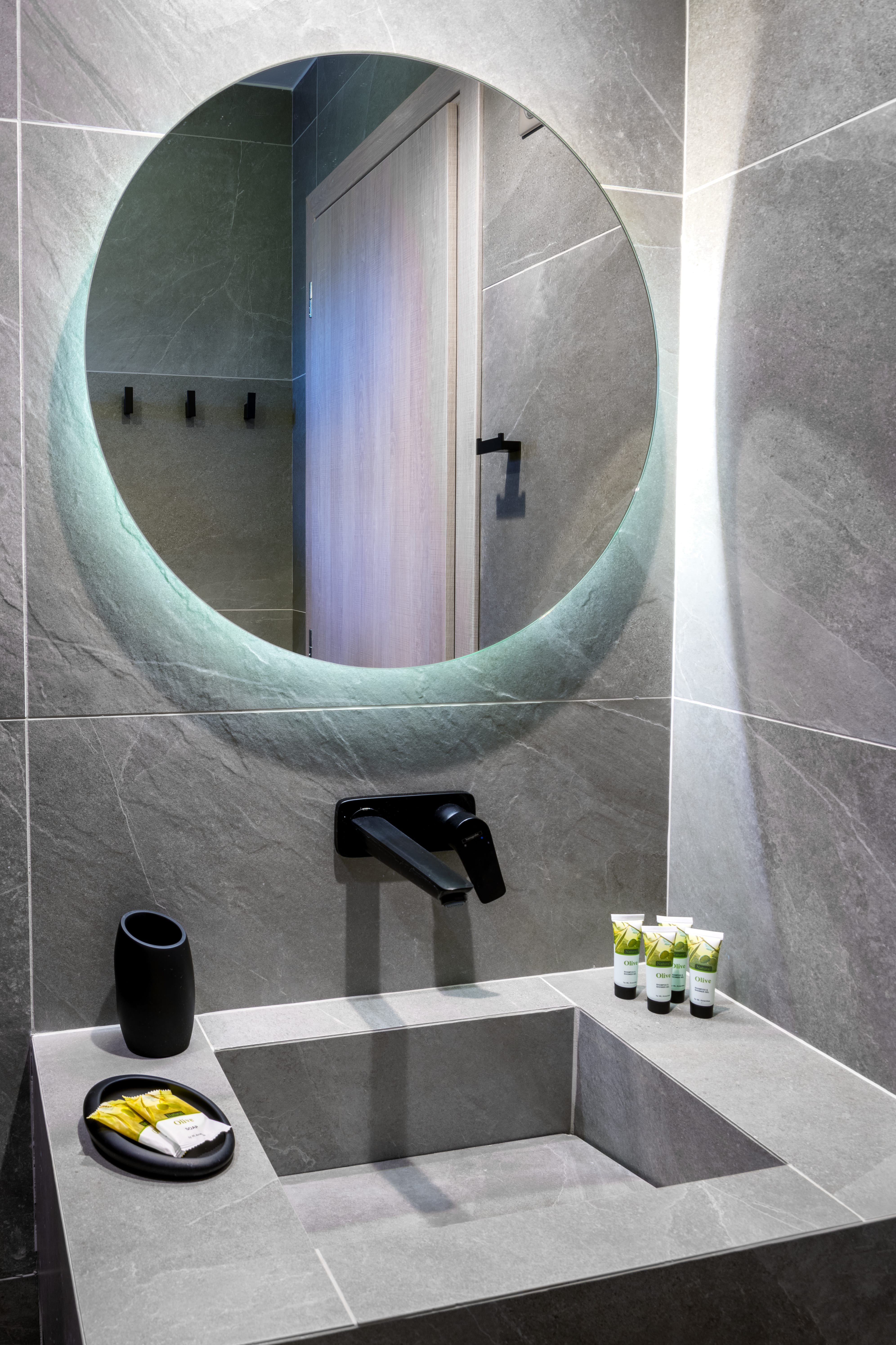 a bathroom with a large mirror