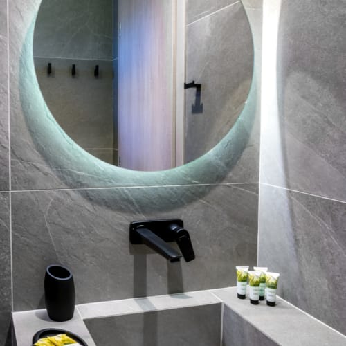 a bathroom with a large mirror