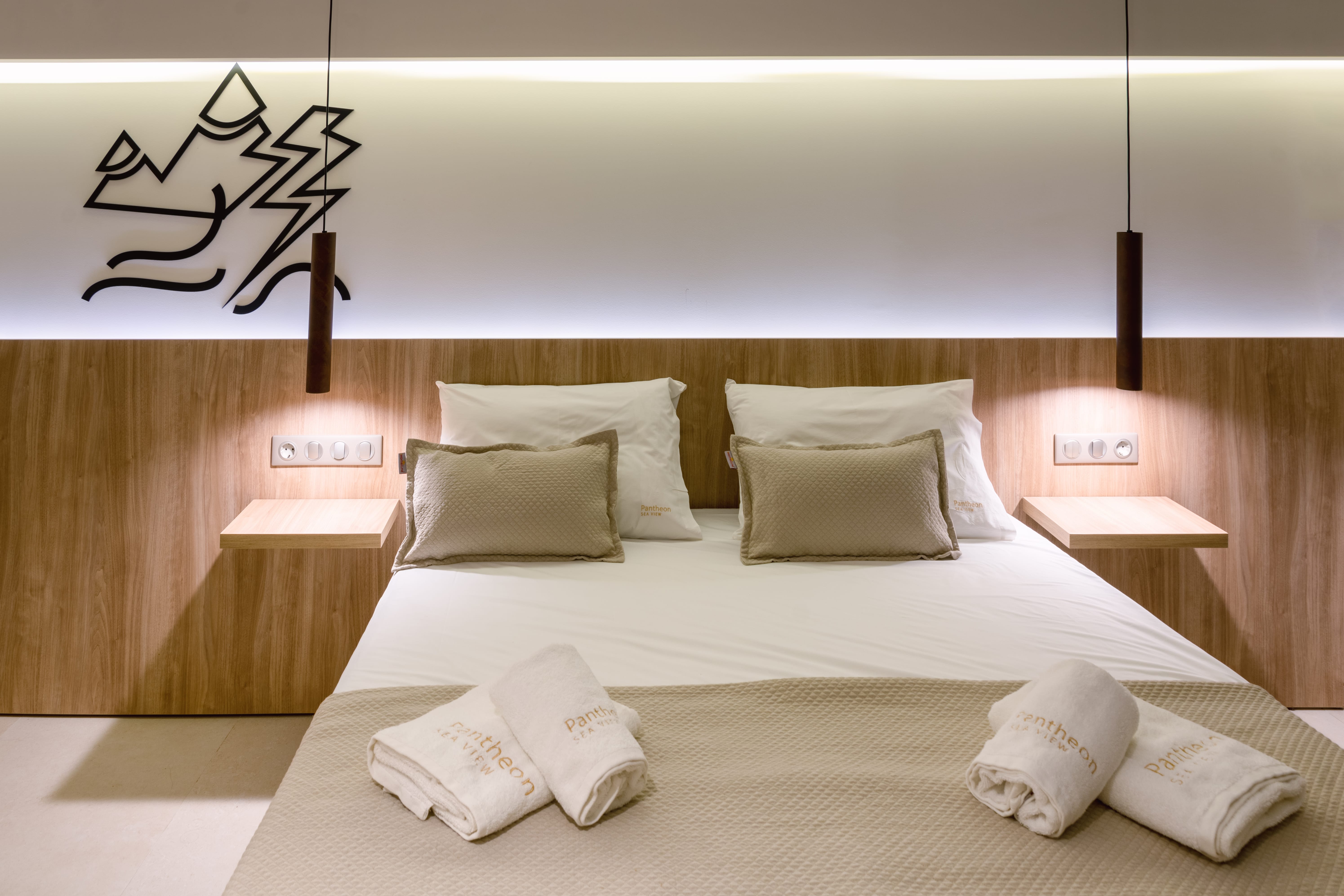 a hotel room with white beds