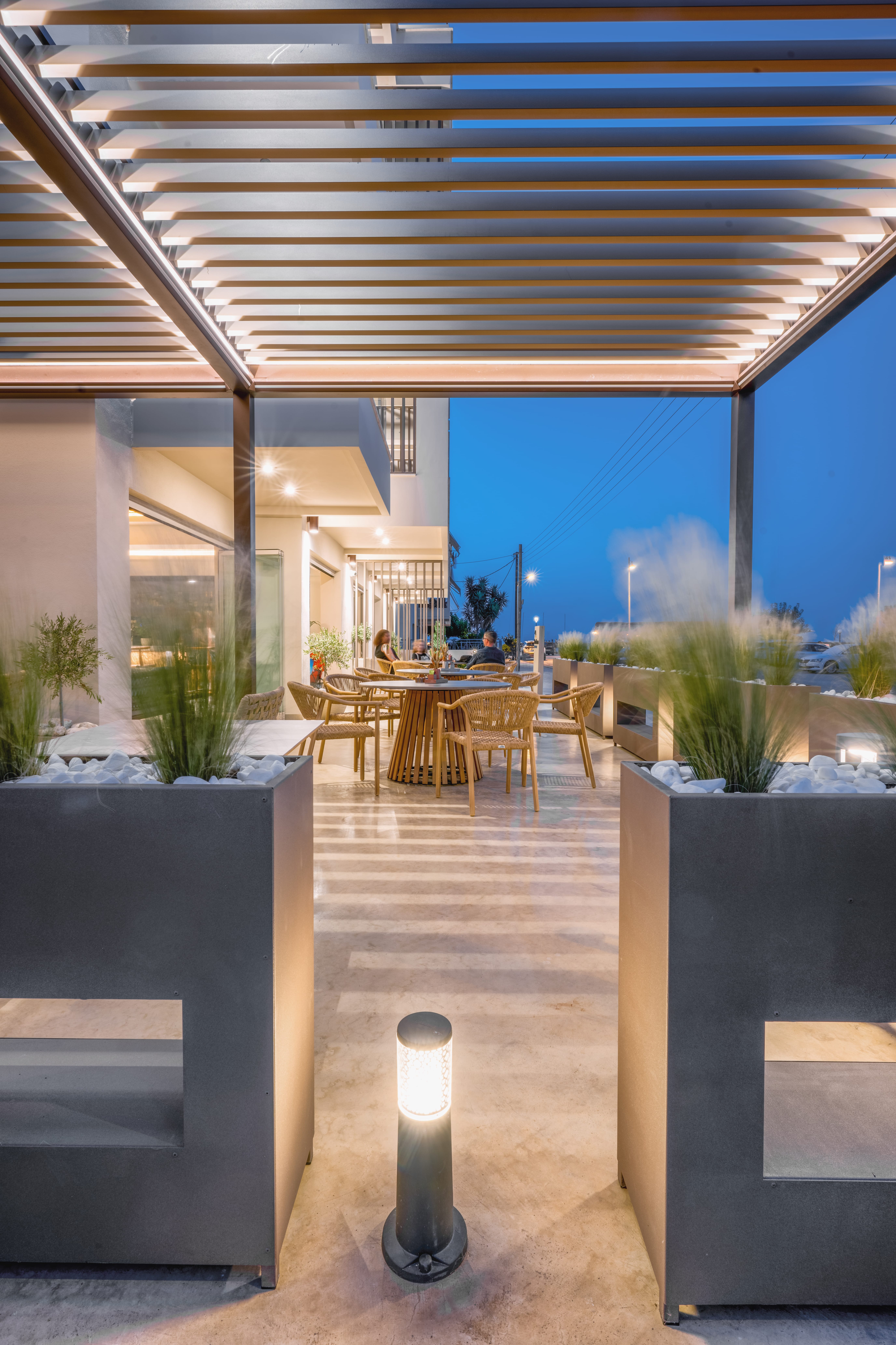 a patio with tables and chairs