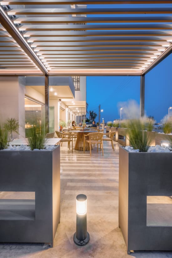 a patio with tables and chairs