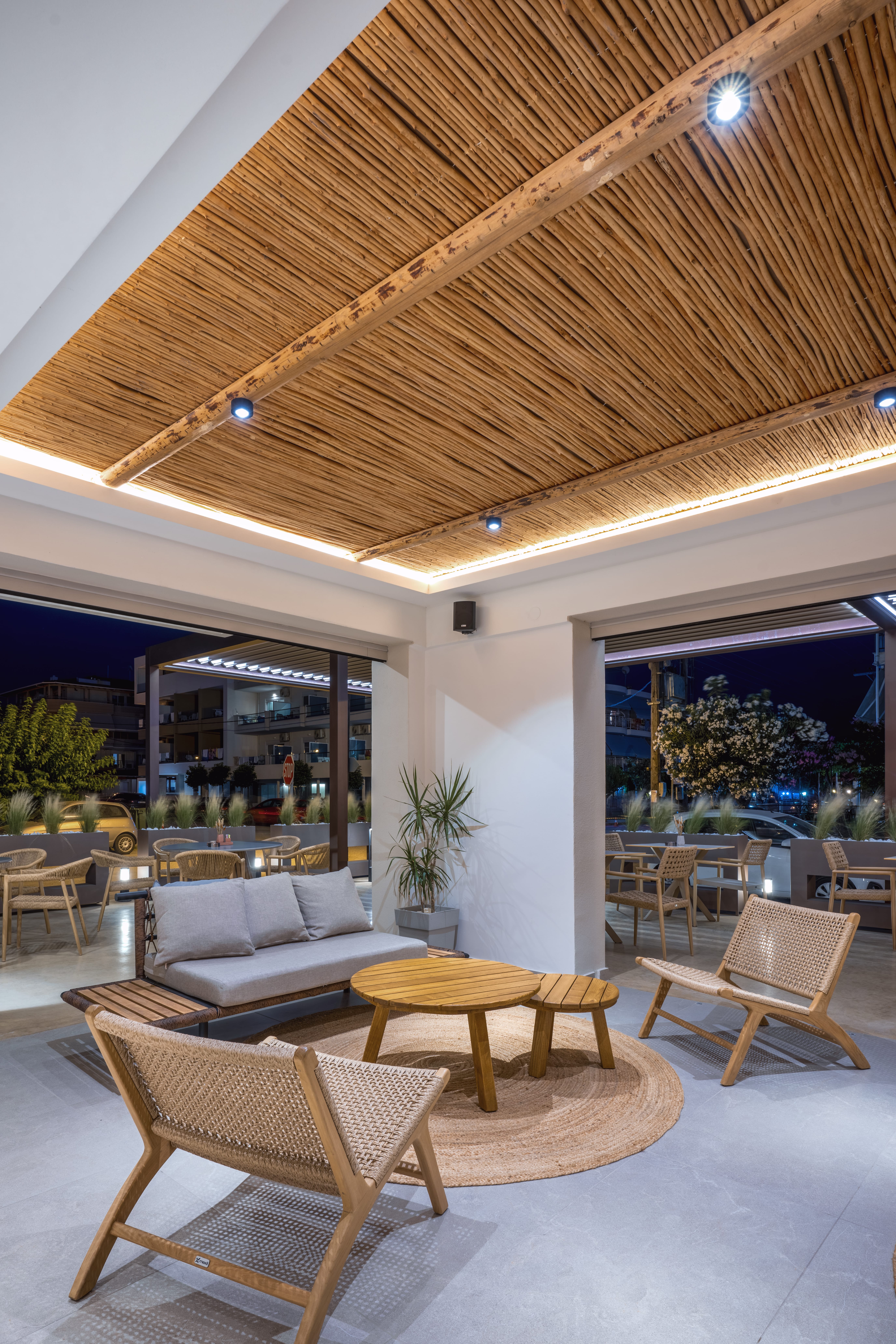 a room with a large ceiling and chairs