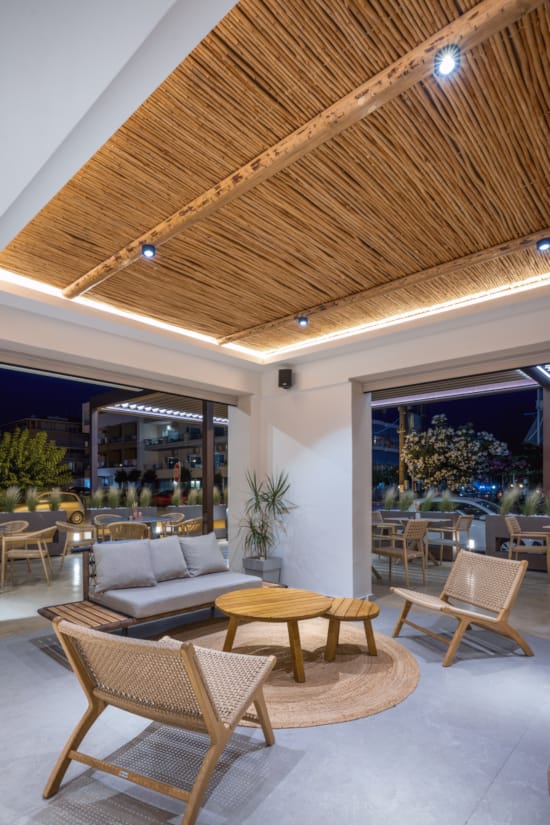 a room with a large ceiling and chairs