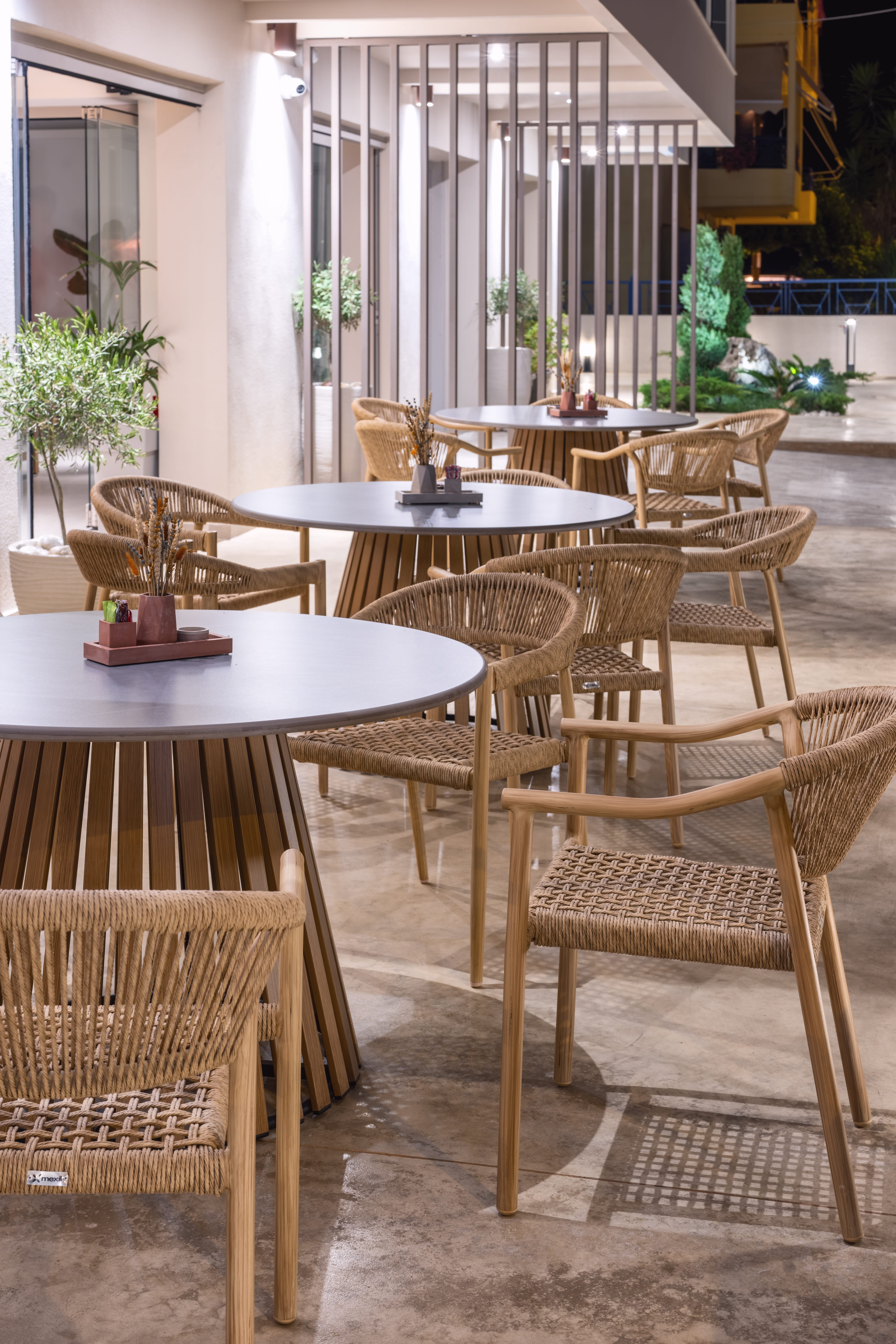 a group of tables and chairs in a room