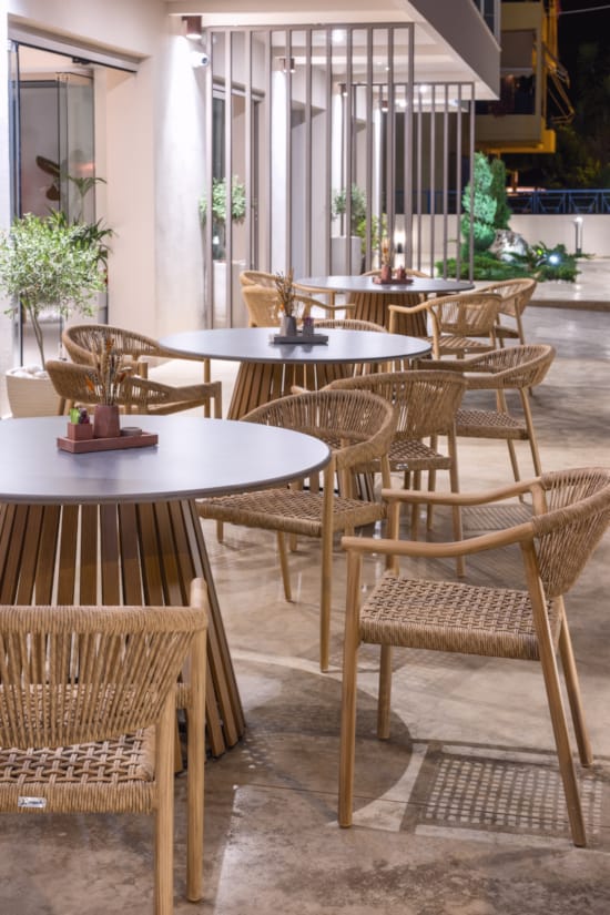 a group of tables and chairs in a room