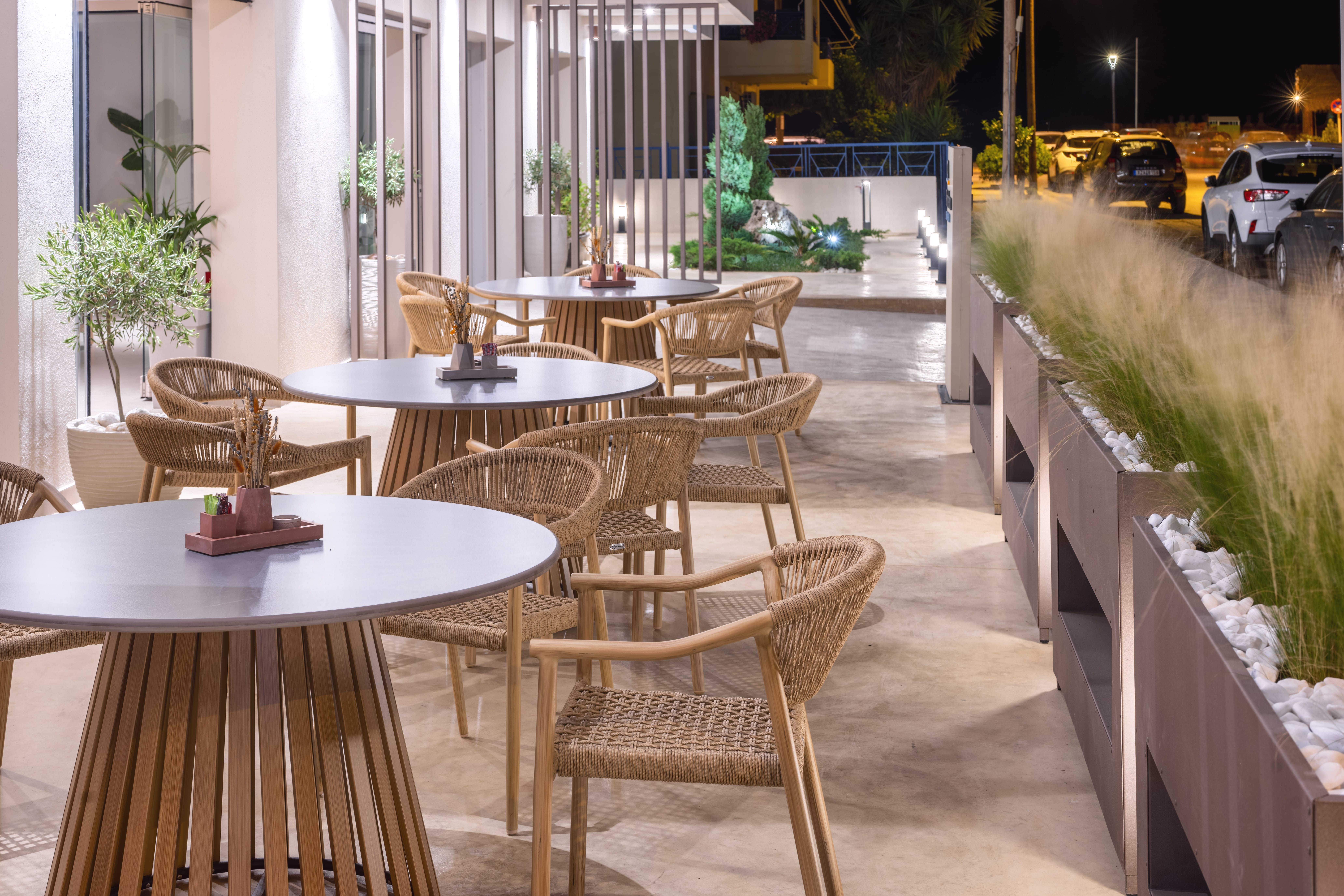 a group of tables and chairs outside