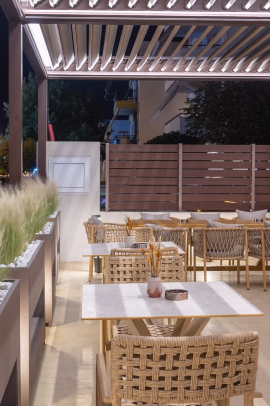 a table with chairs and a refrigerator