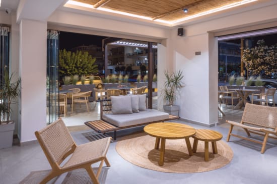 a living room with a couch and chairs