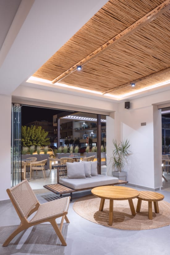 a living room with a large glass ceiling