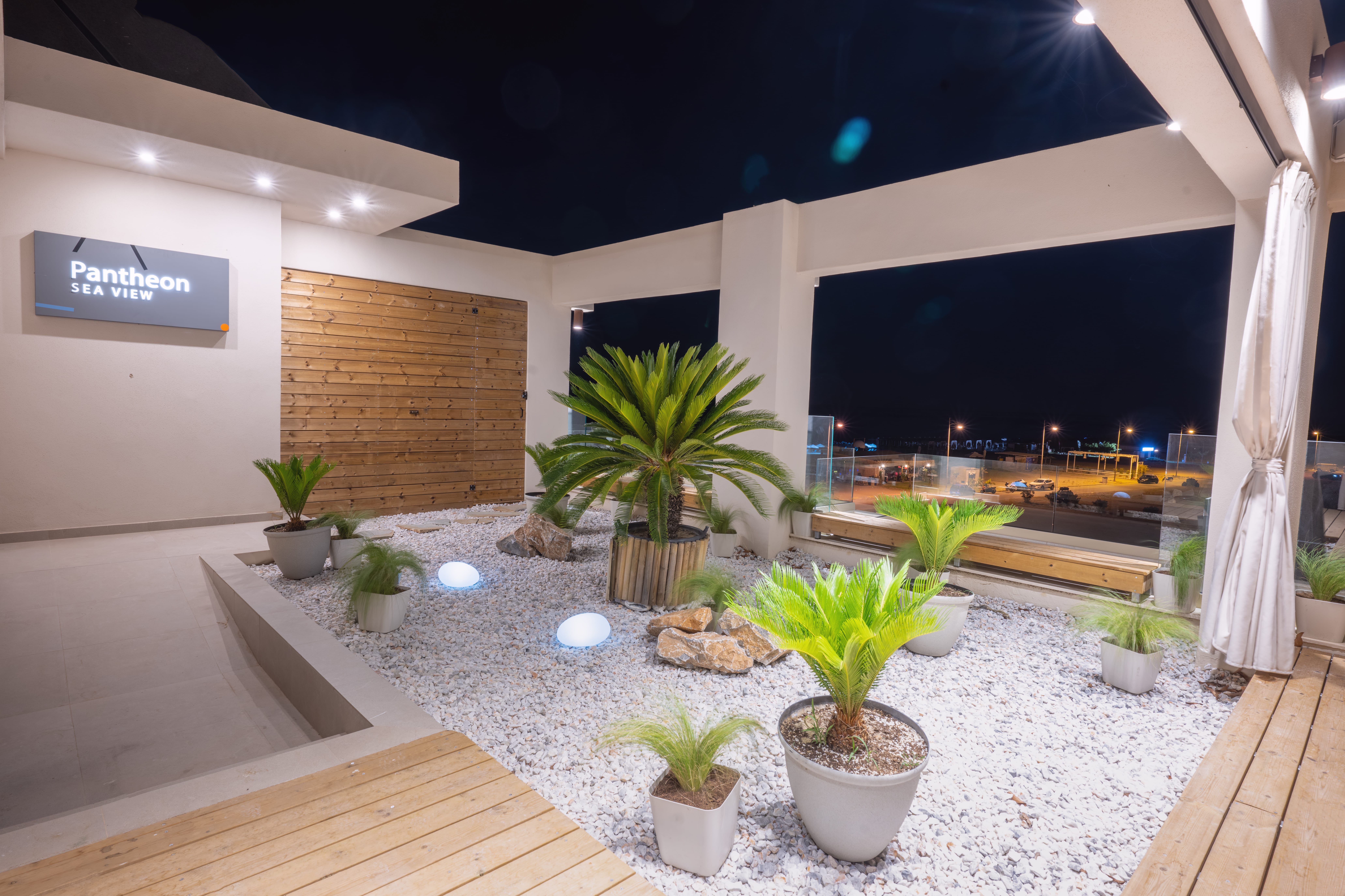 a room with plants and a stage