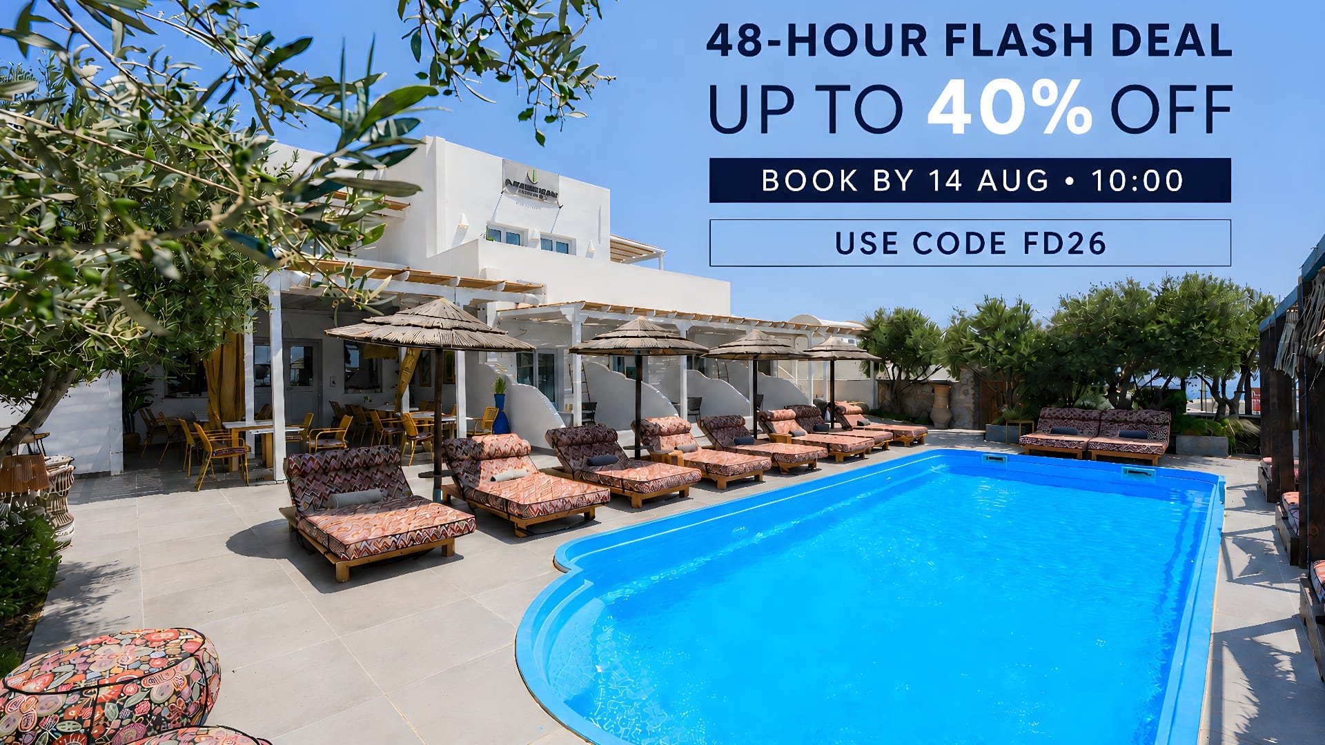 a pool with lounge chairs and umbrellas