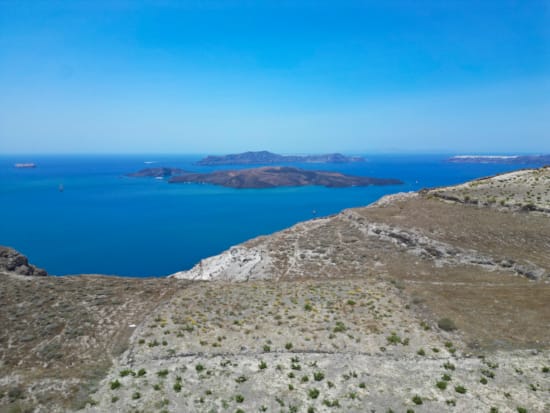 a body of water surrounded by hills