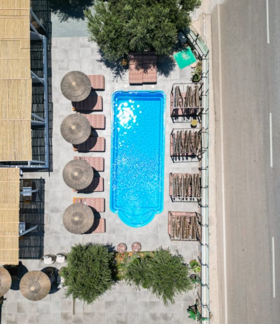 a blue surfboard on a sidewalk
