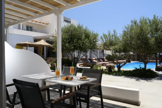 a table with chairs and a table outside