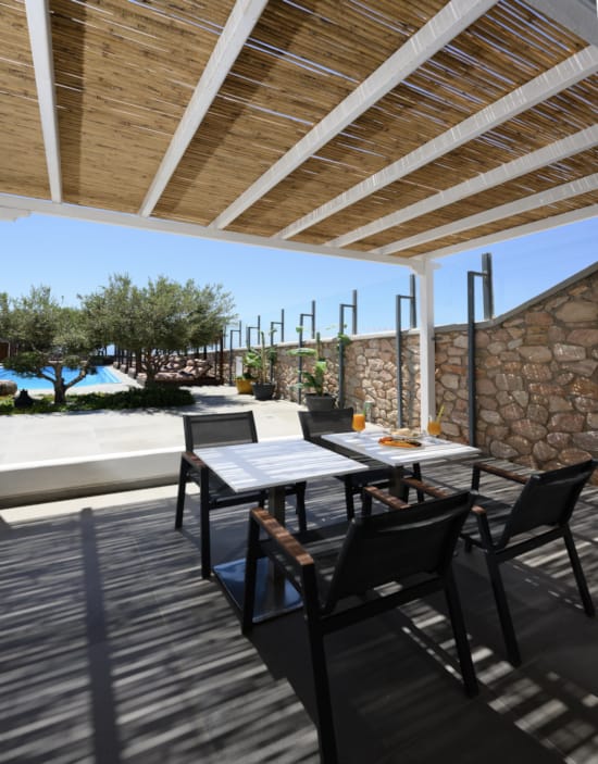 a patio with tables and chairs