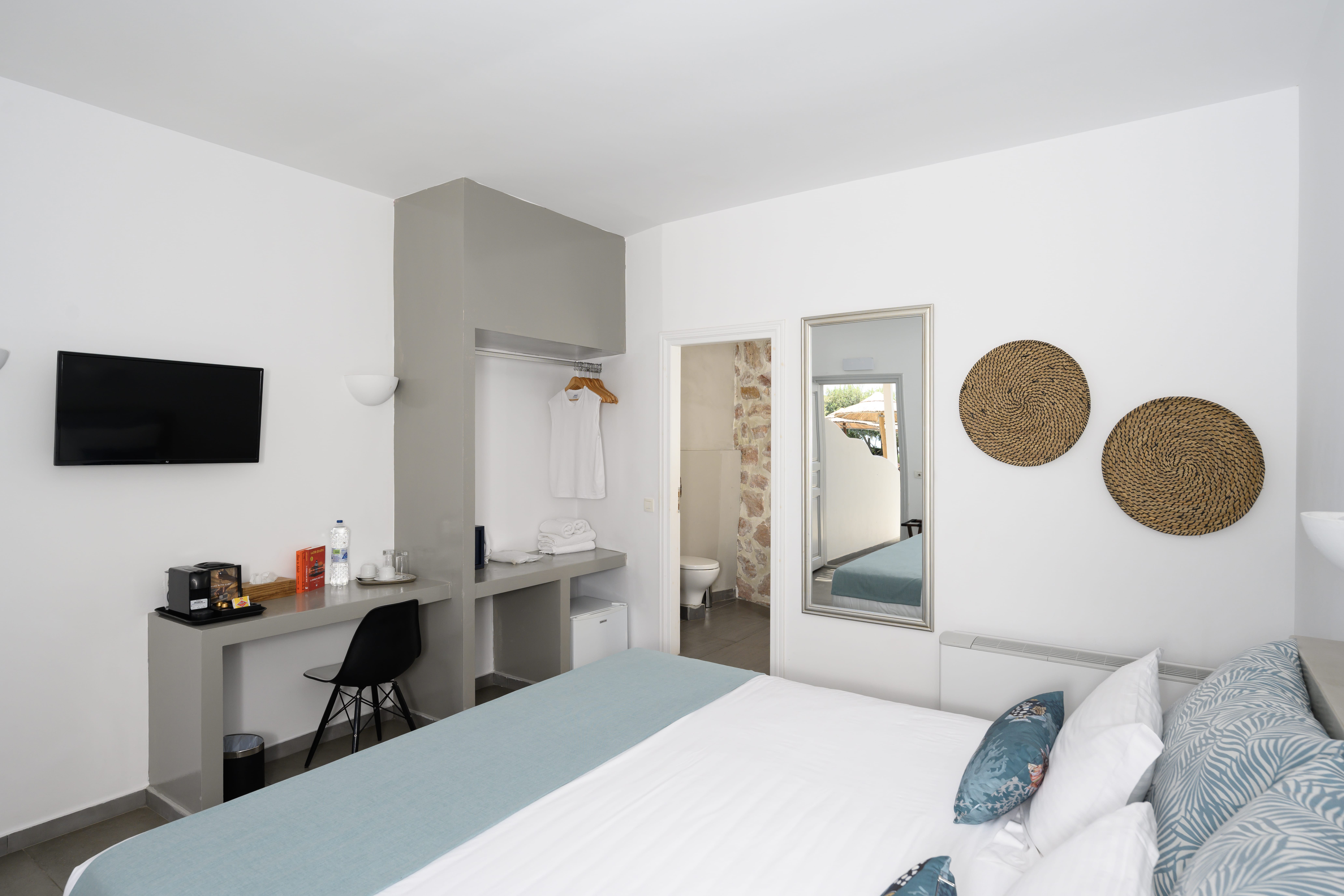 a room with a bed and a desk