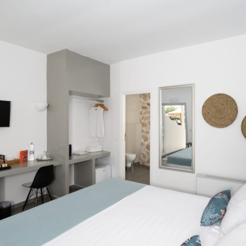 a room with a bed and a desk