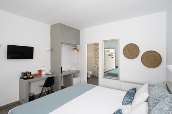 a room with a bed and a desk