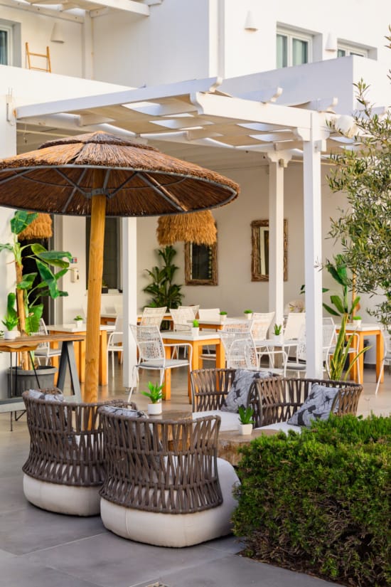 a patio with tables and chairs