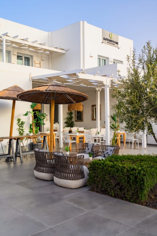 a patio with umbrellas and chairs